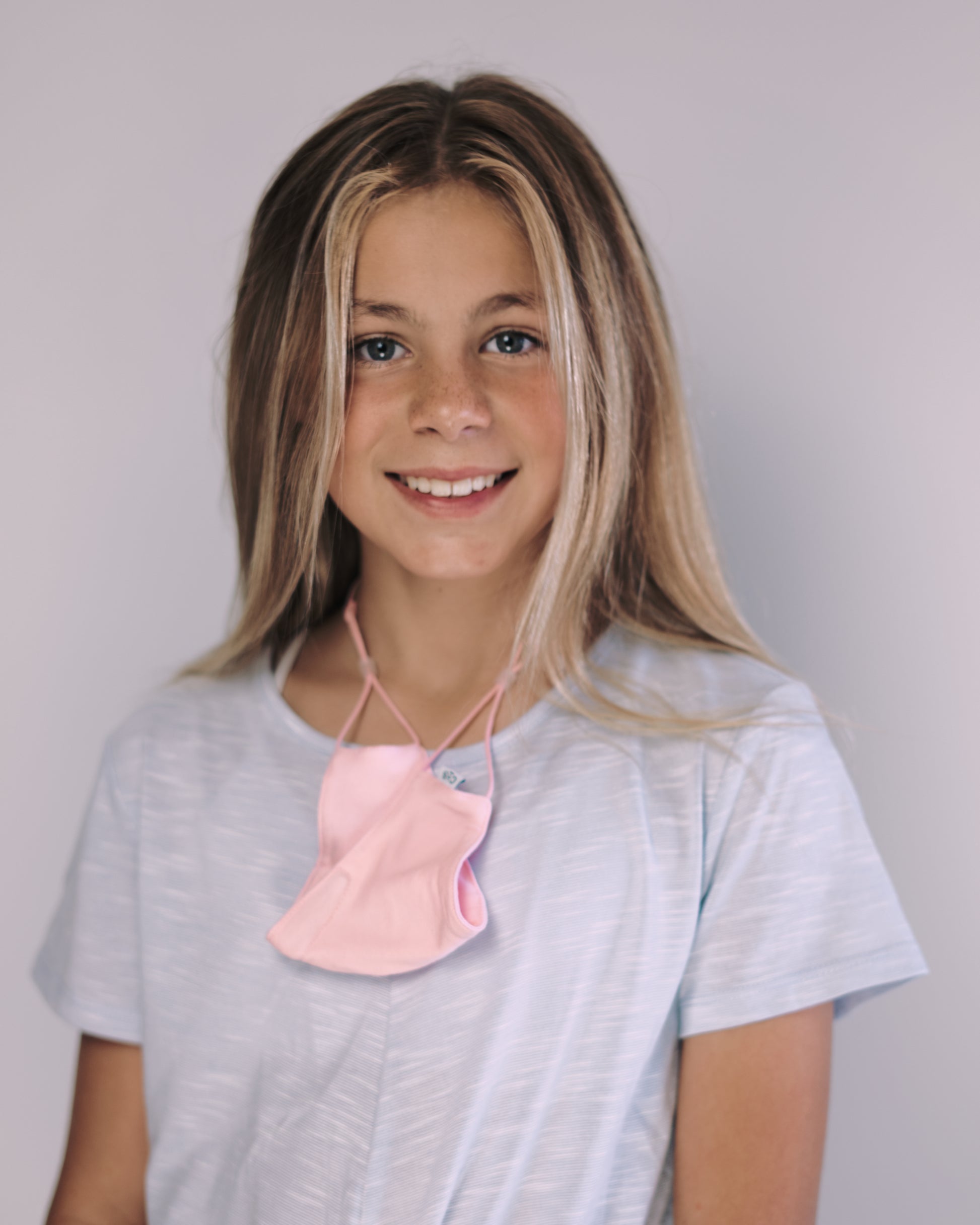Girl with pink facemask around her neck  facemasks forsale facemasksaustralia facemaskstrap SheikeStik